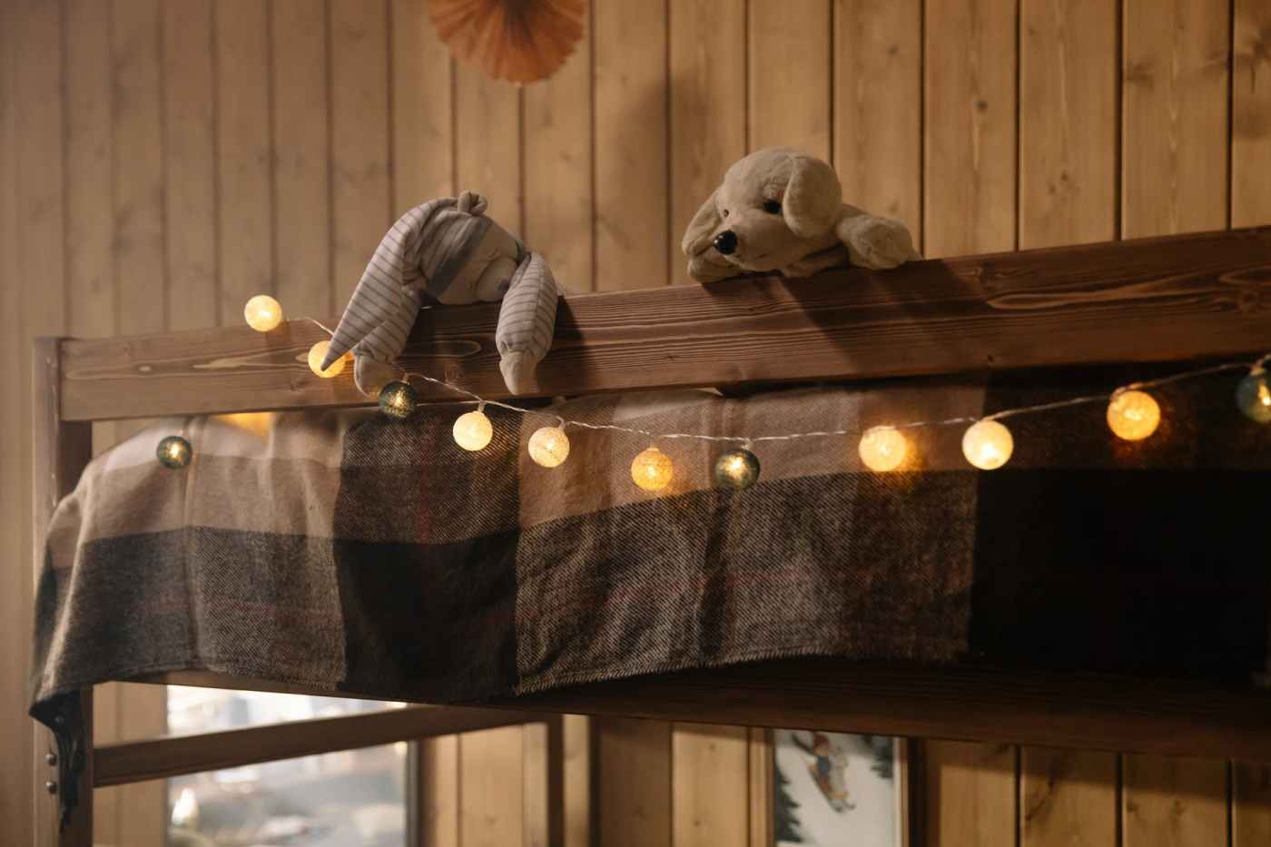 two plush toys on wooden surface